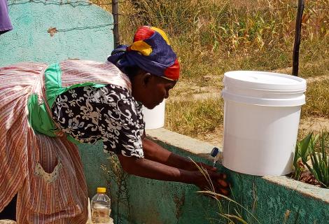 A woman washing her hands
